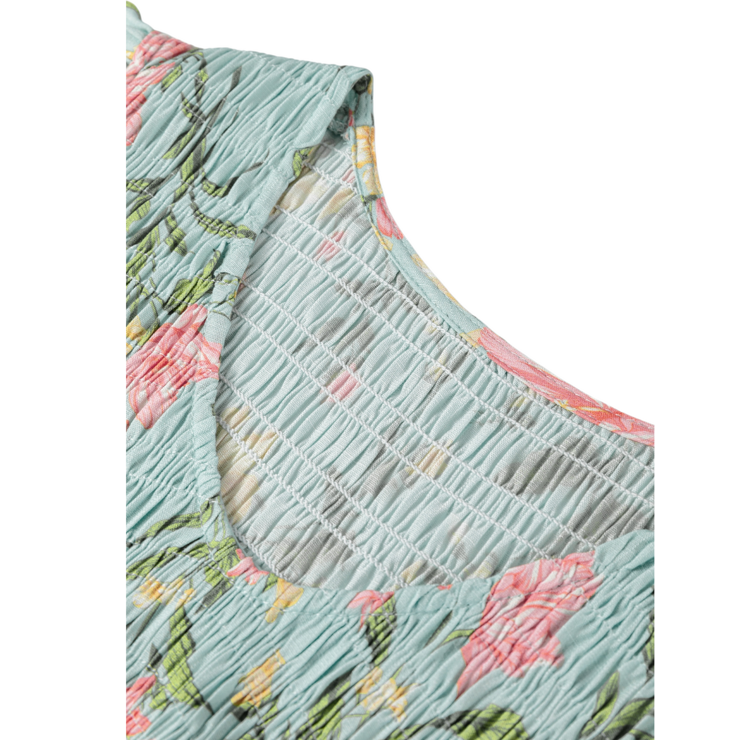 Floral dress with smocked bodice on a white background