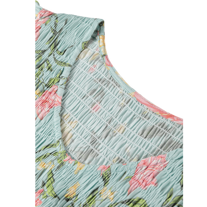 Floral dress with smocked bodice on a white background