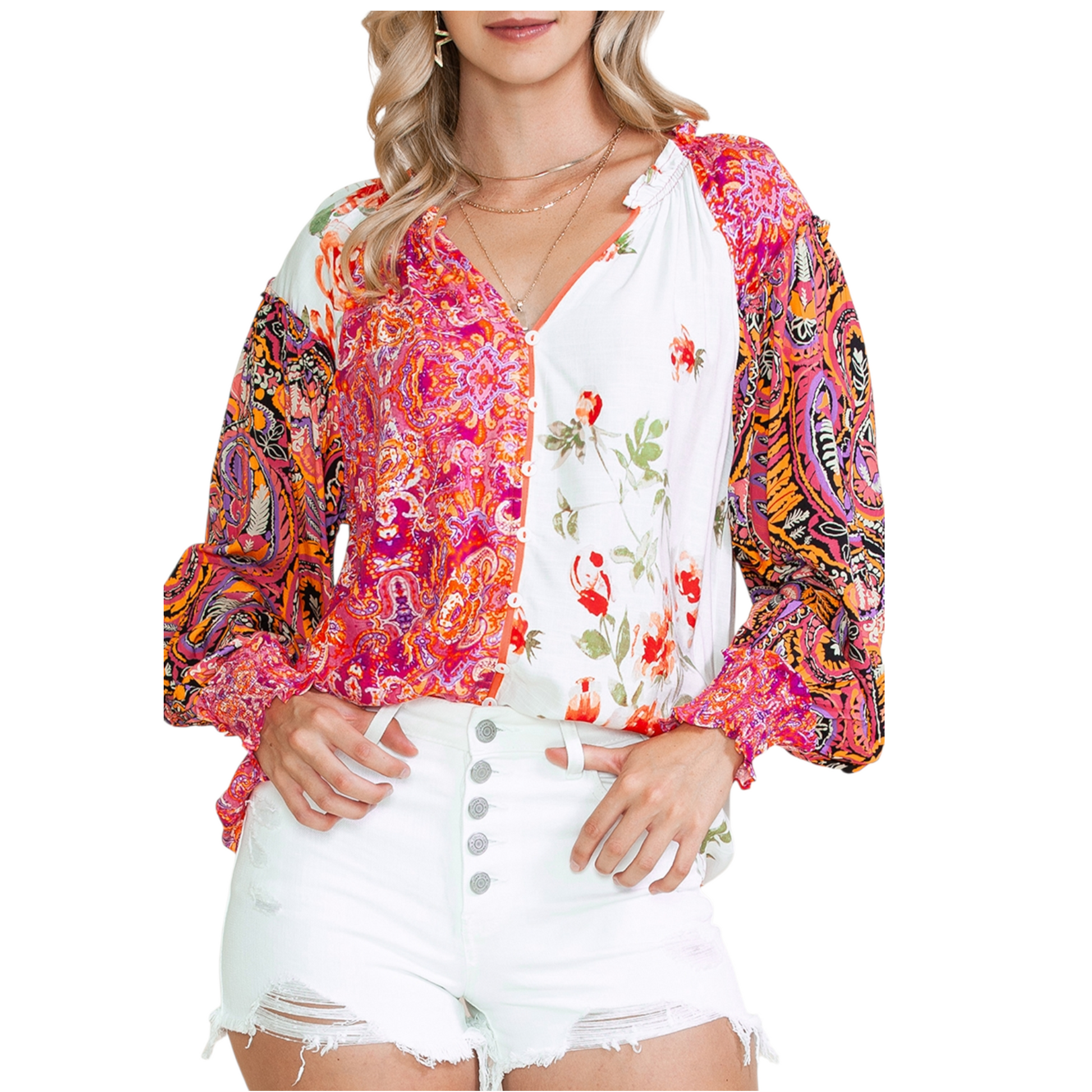Woman wearing a multi-coloured patchwork floral viscose blouse with a V-neckline and button-down front.
