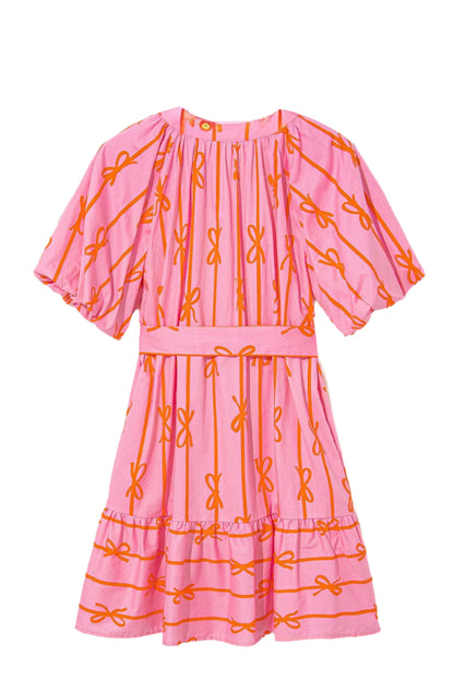 Back view of pink mini dress with bow print details, perfect for summer occasions.