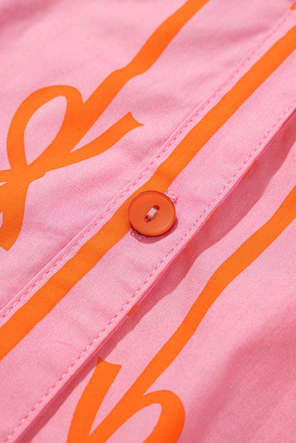 Pink mini dress with bowknot print and bubble sleeves - focus view on its button feature.