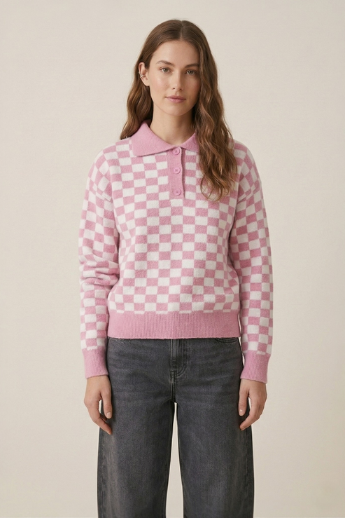 Pink checkerboard polo knit jumper front view showing polo collar and button placket detail