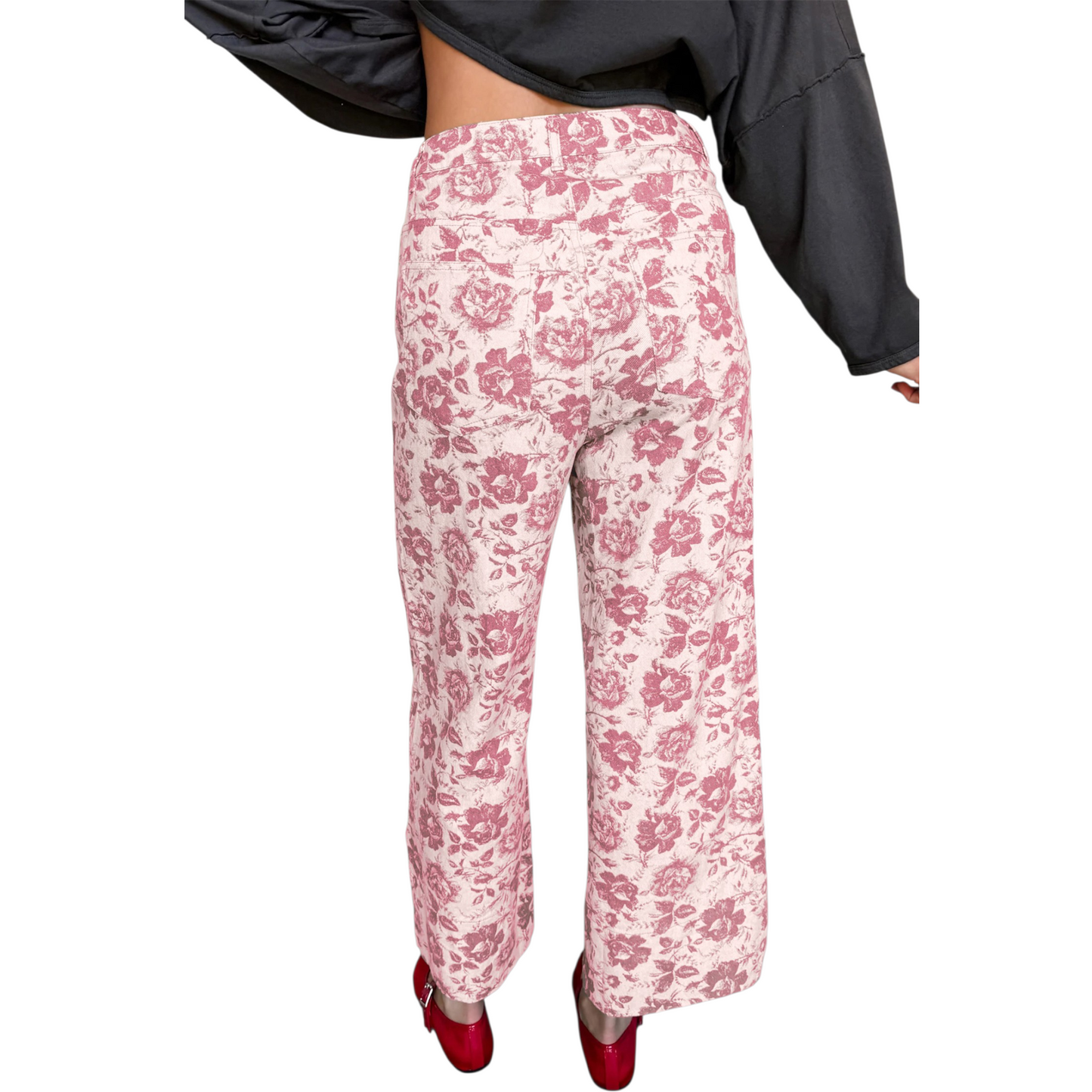 Back view of pink floral print jeans showing the flattering straight-leg fit and functional rear patch pockets.