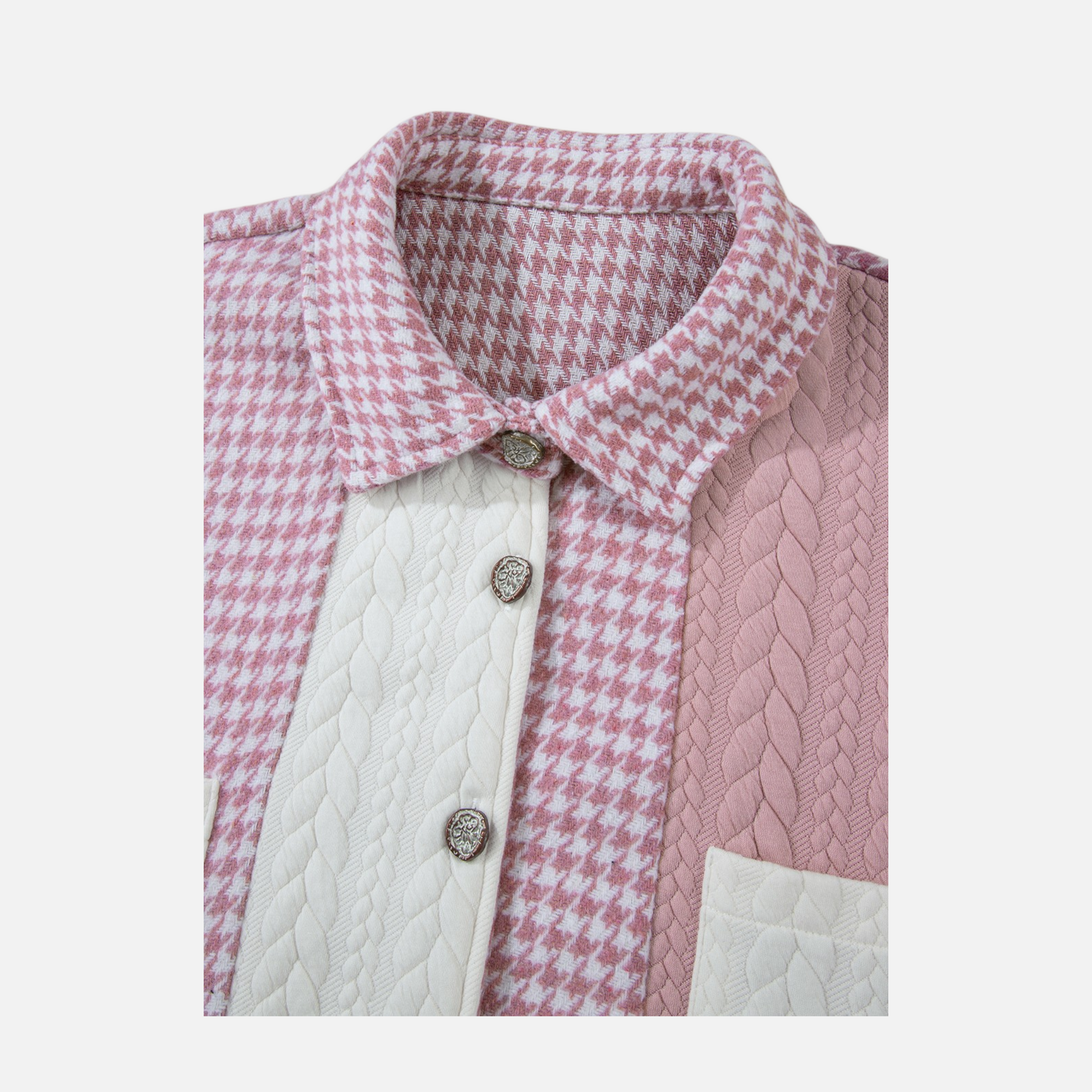 Pink and white checkered shirt with cable knit pattern on a light gray background