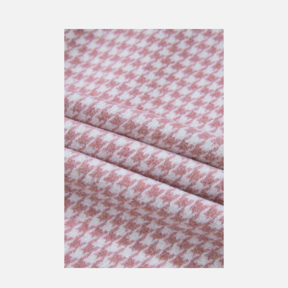 Close-up of pink and white checkered fabric on a light gray background