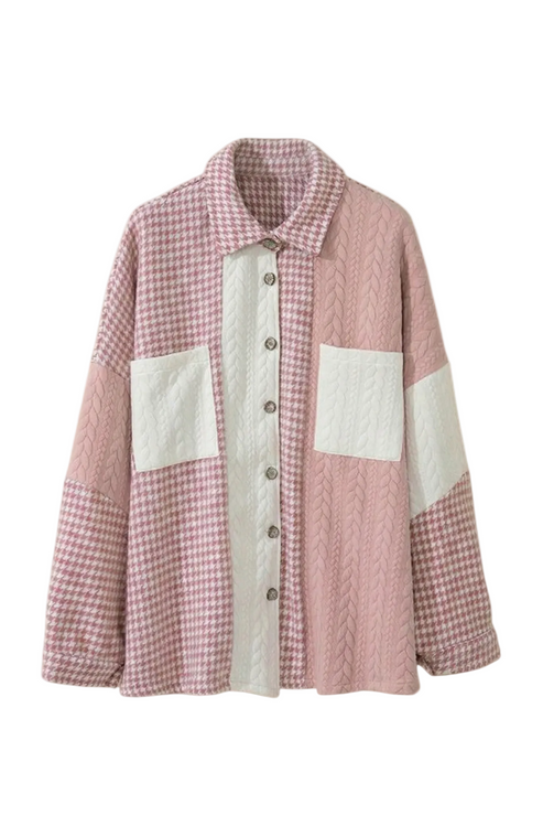 Front view of a pink and white houndstooth and cable-knit patchwork shacket with a button-down front and dual chest pockets.