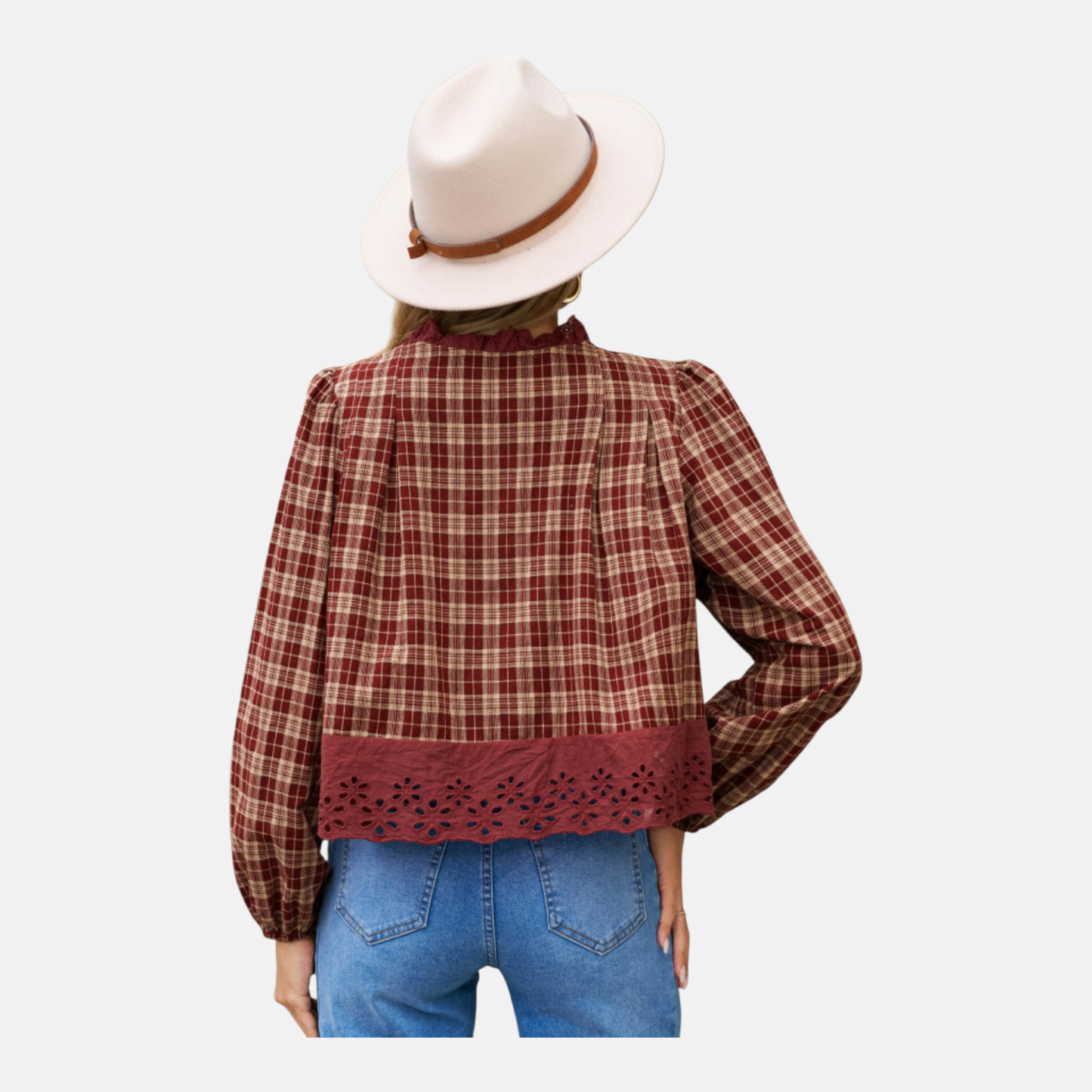 The rear view of the burgundy plaid blouse paired with light-wash denim and a fedora hat, highlighting the consistent checkered pattern and the detailed eyelet embroidery at the hem.