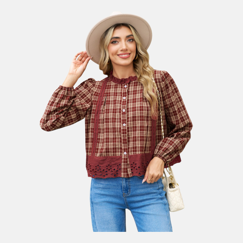 A full-length lifestyle shot of the burgundy plaid blouse with the eyelet hem, demonstrating a casual-chic outfit styled with light-wash straight-leg jeans and neutral accessories.