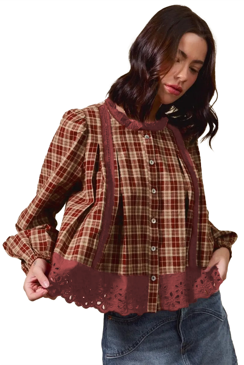 Woman wearing a plaid blouse with lace details on a white background