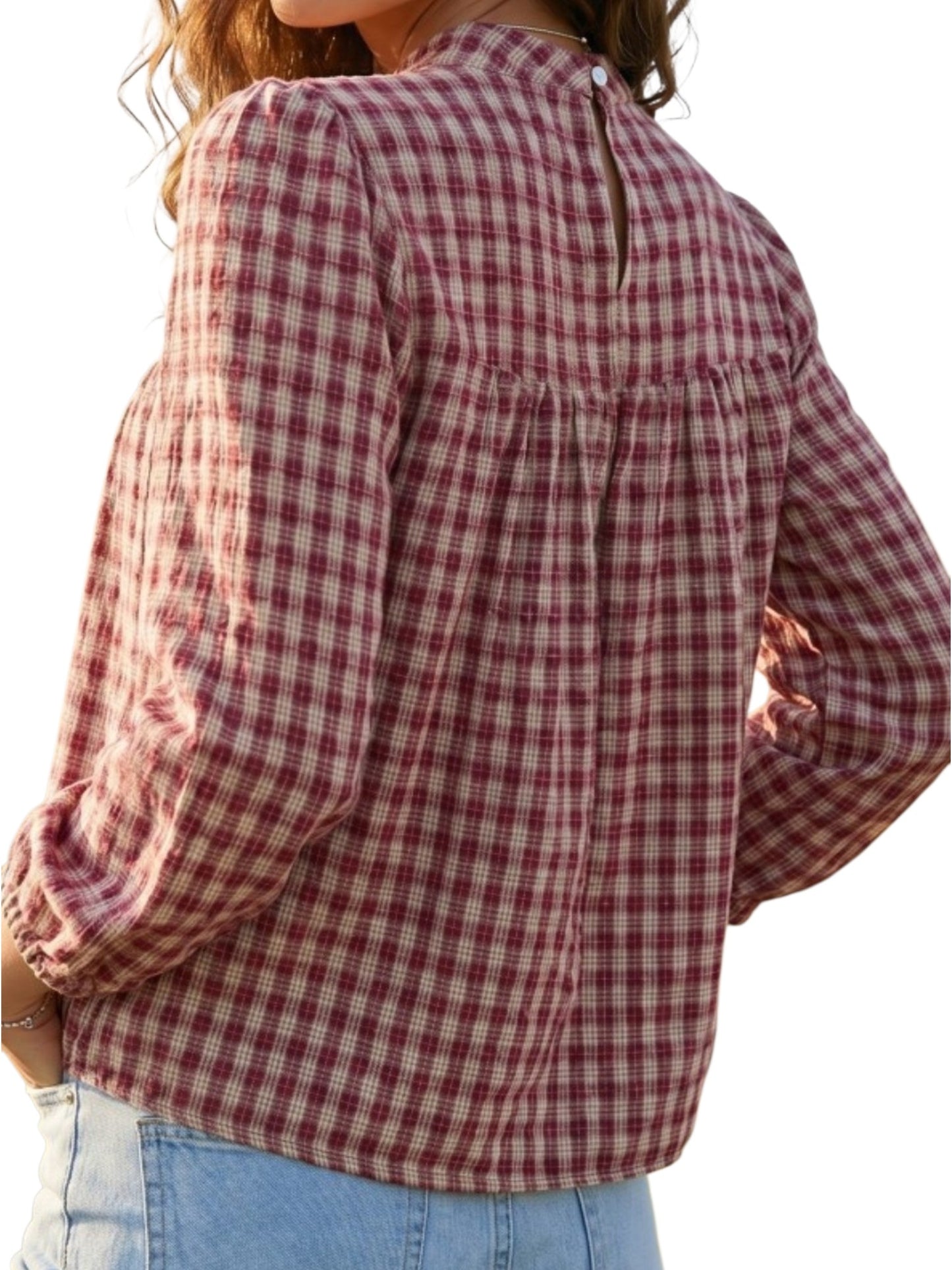 Plaid pleated babydoll blouse on the model back view