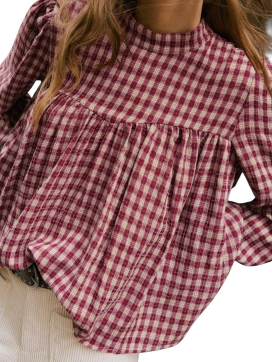 Plaid pleated babydoll blouse on the model front view at closed up
