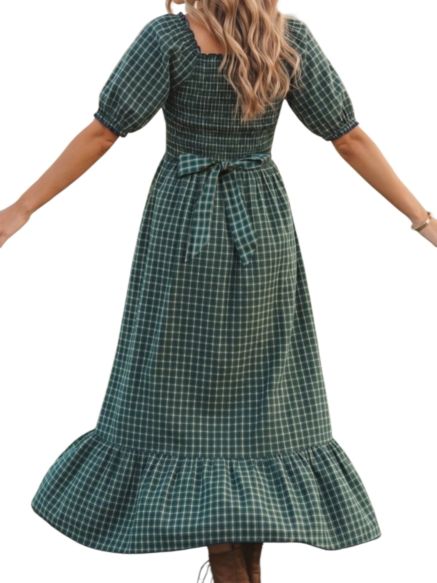 Green plaid dress worn by a person on a white background