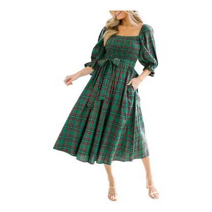 Green plaid dress with long sleeves on a white background