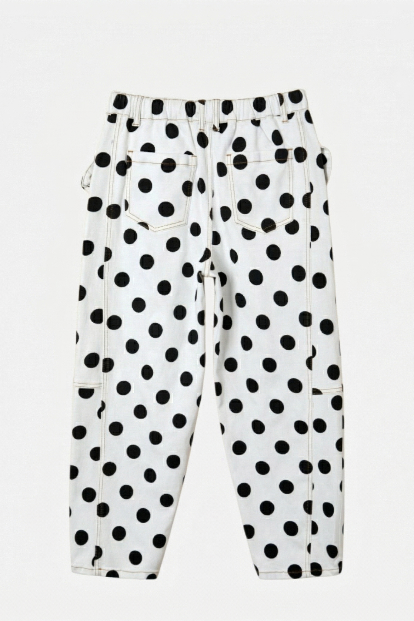 Back flat lay of white wide-leg jeans with a bold black polka dot pattern and an elasticated waistband.