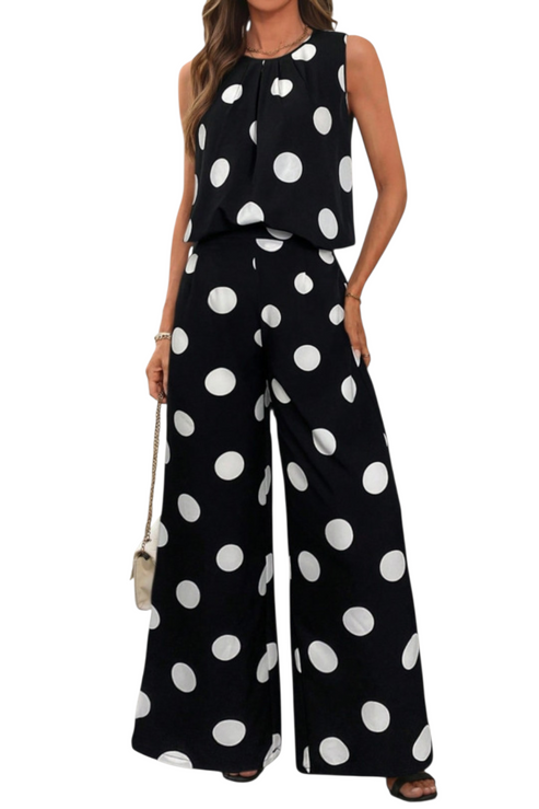 Full-length front view of a two-piece polka dot outfit featuring a relaxed sleeveless top with a pleated neckline and high-waisted wide-leg pants.