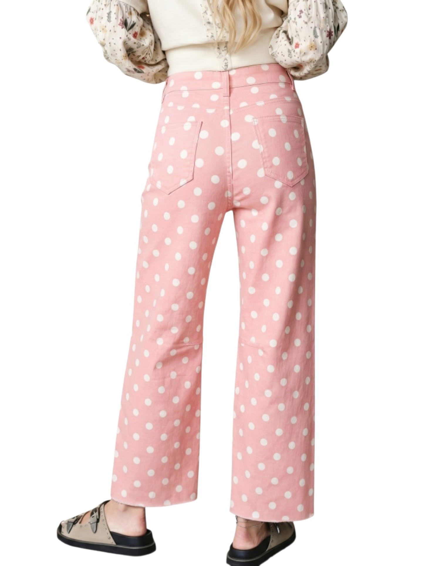 Pink wide-leg pants with a white polka dot pattern, shown on a model from the back against a white background.