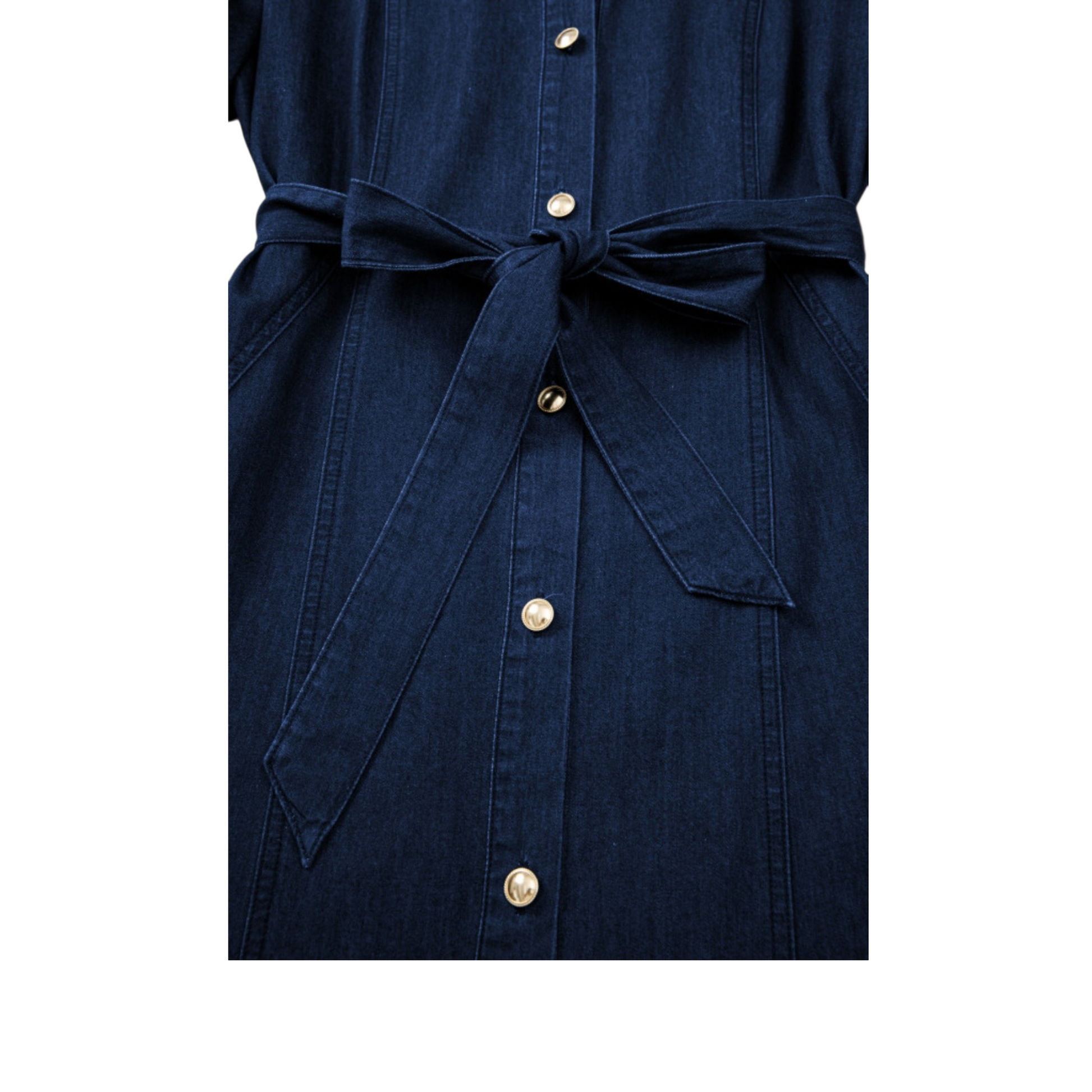 Close-up of the adjustable denim waist tie and metallic gold buttons on the deep indigo midi dress.
