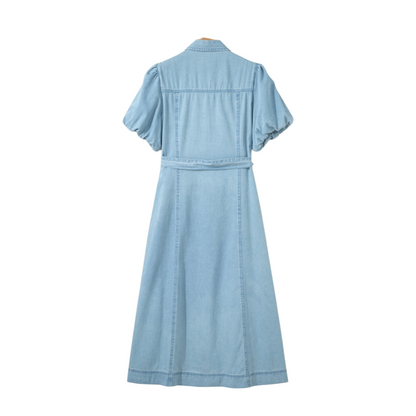 Rear view of the vintage light wash denim midi dress, showcasing the breathable 100% cotton fabric and structured silhouette.