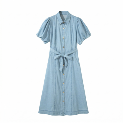 Front flat lay of the light wash denim midi dress, featuring a functional button placket and feminine puff-sleeve design.