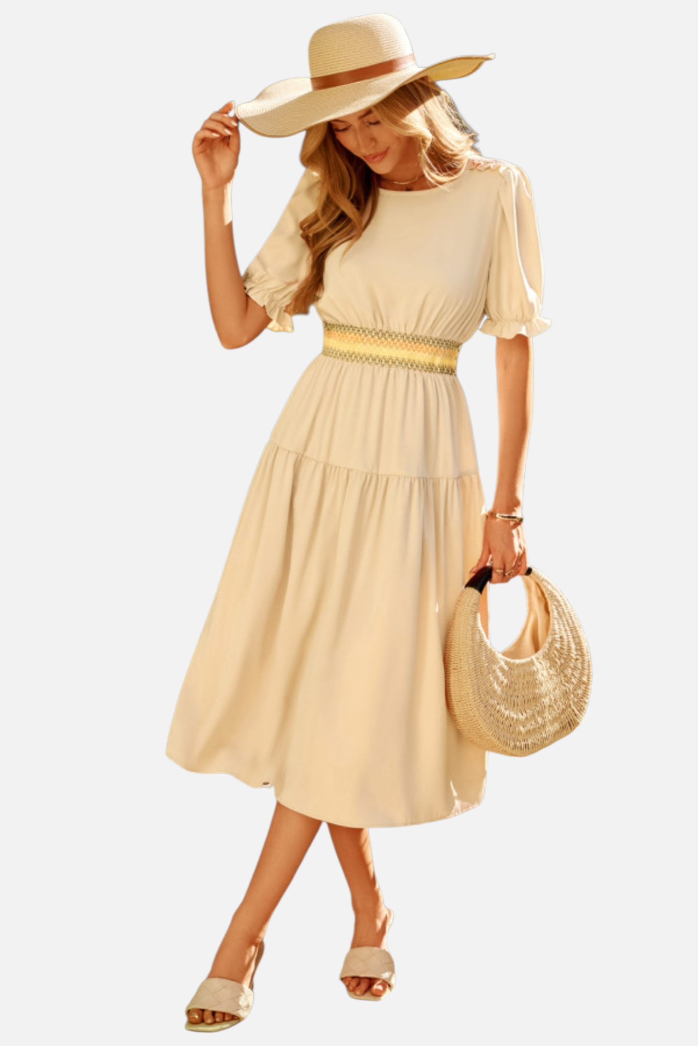 Woman wearing a beige dress and hat with a straw bag on a white background
