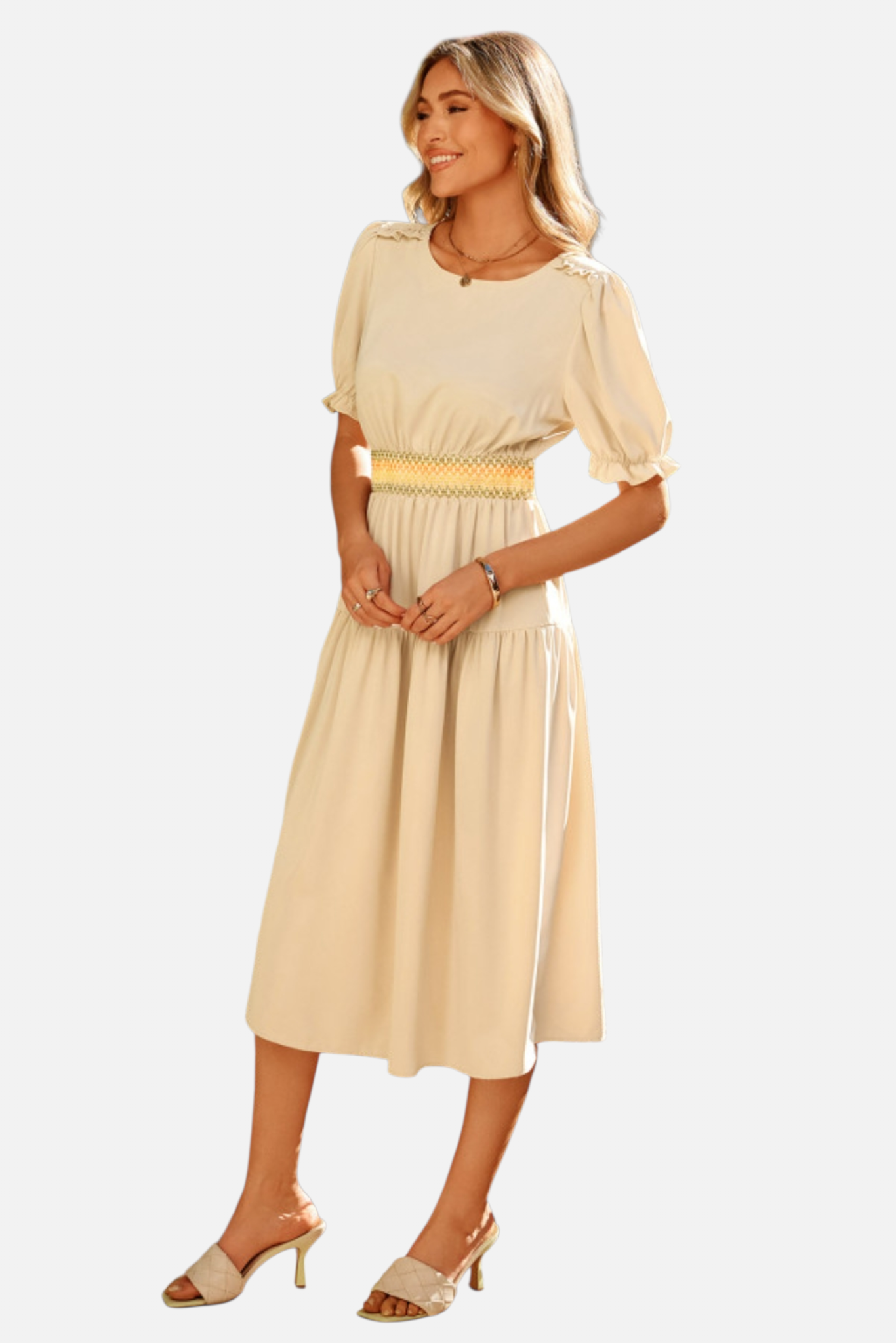 Woman wearing a beige dress with a yellow belt on a white background
