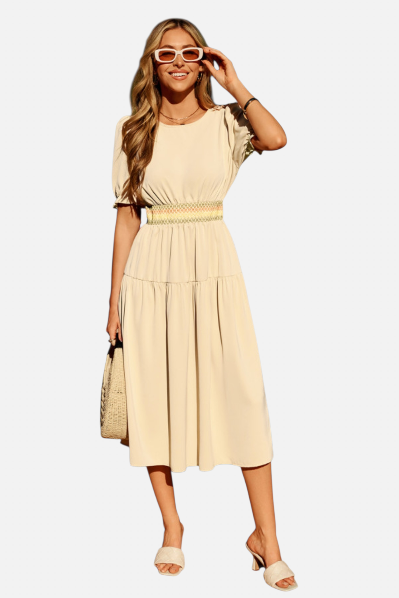 Woman wearing a beige dress and sunglasses on a white background