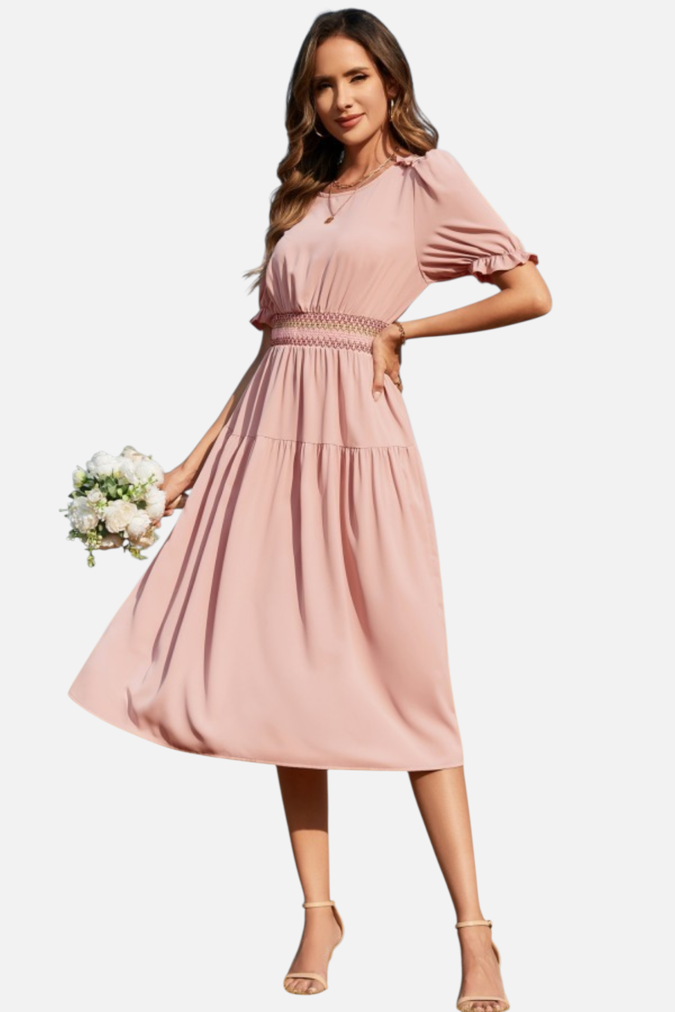 Woman wearing a pink dress holding flowers on a white background