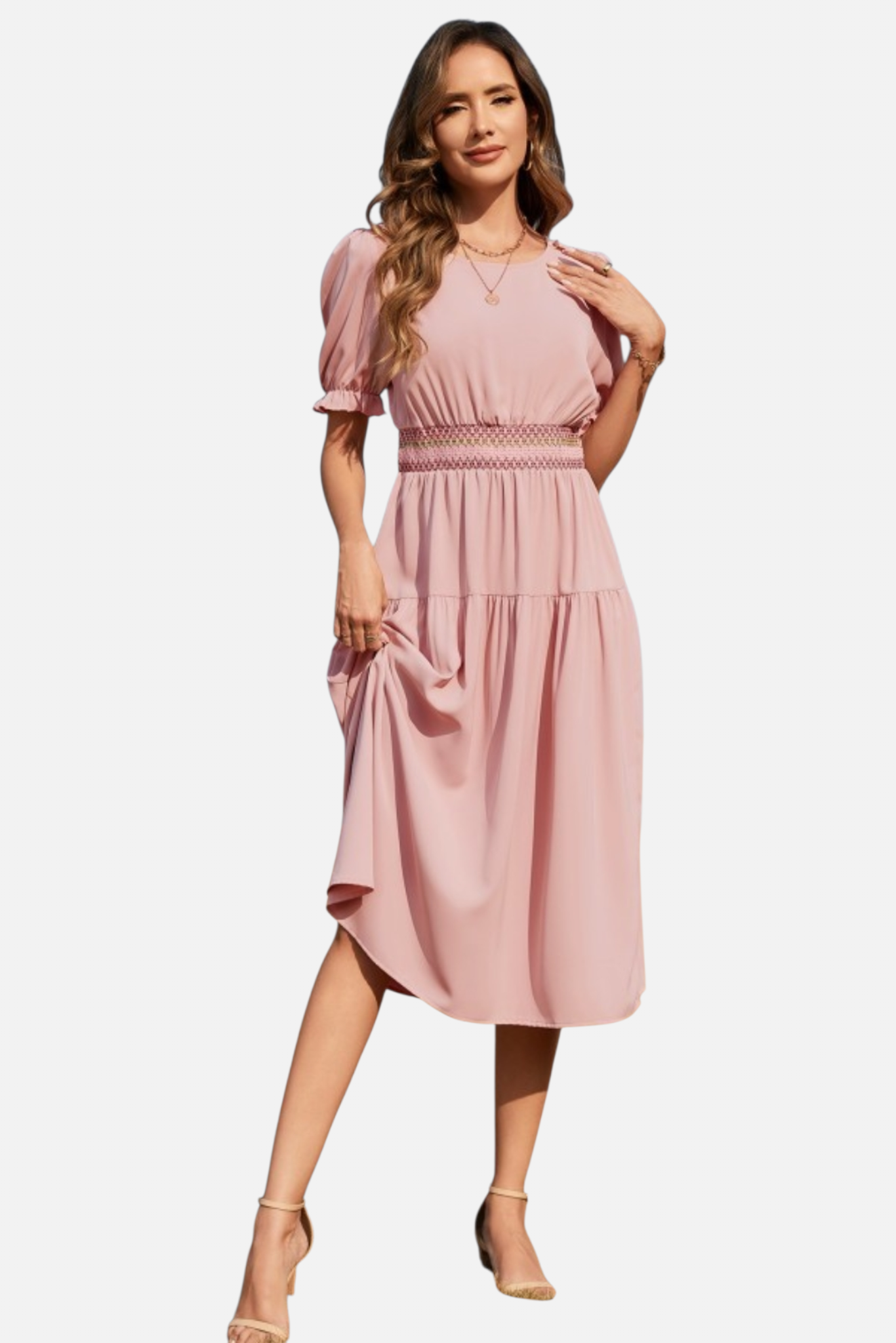 Woman wearing a pink dress on a white background