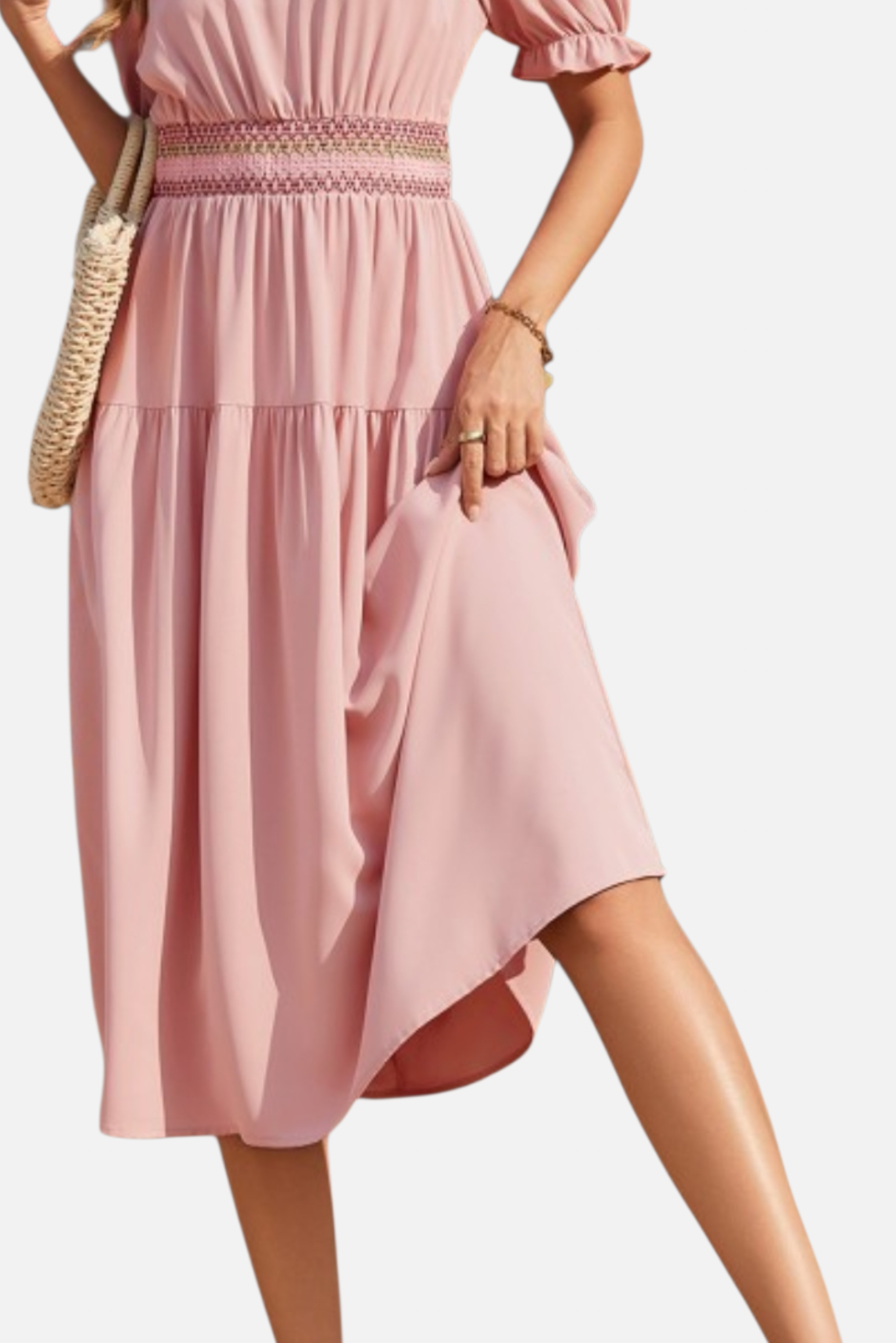 Pink dress worn by a person on a white background