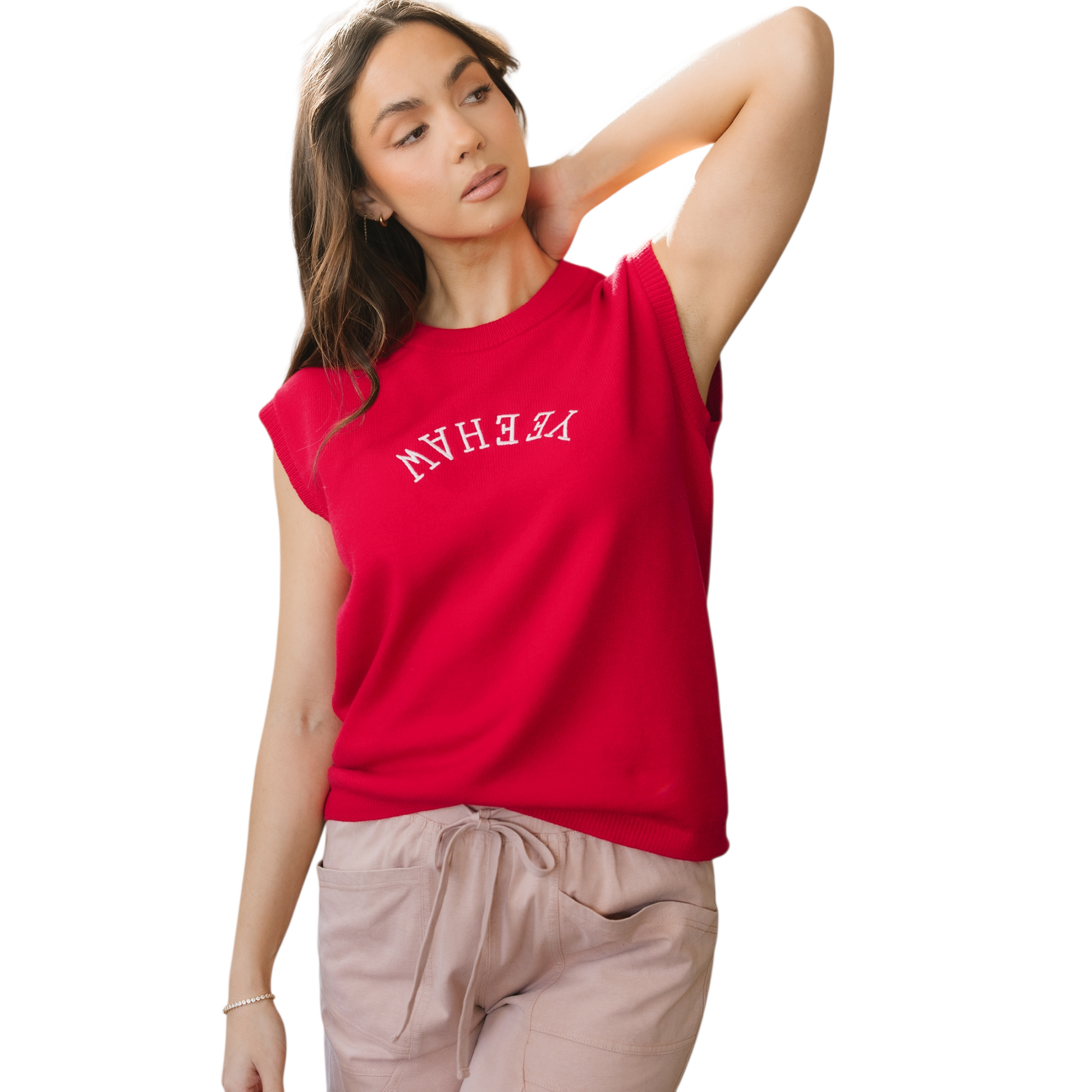Model wearing a vibrant red sleeveless knit vest with white "YEEHAW" embroidery in a western font across the chest.