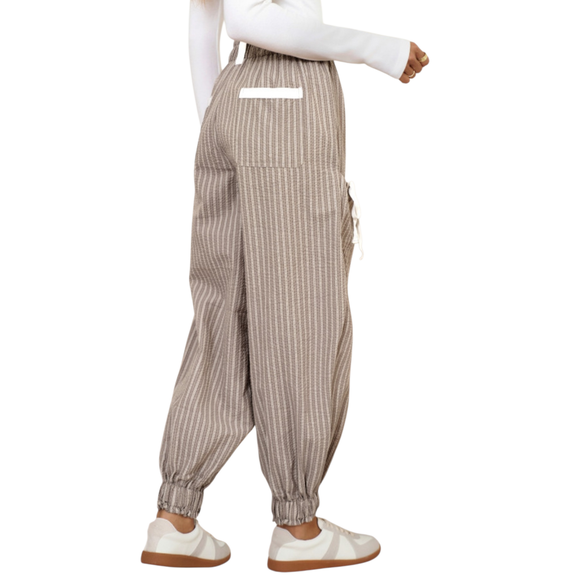 Striped overalls worn by a mannequin on a white background