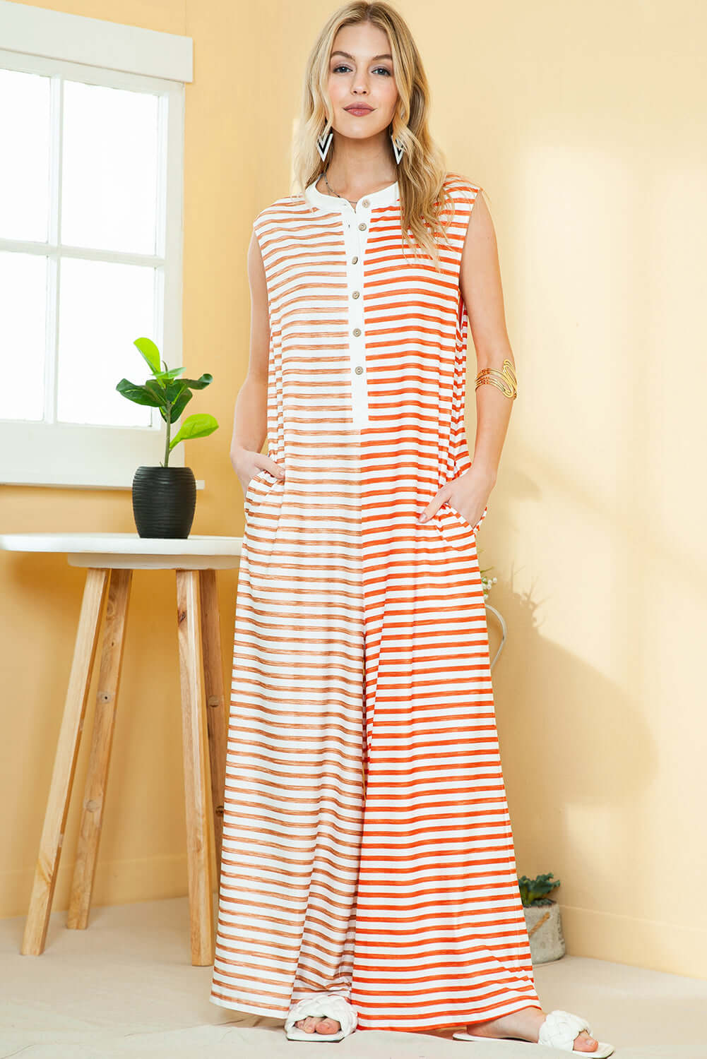 Lightweight and comfortable wide-leg orange jumpsuit for women.