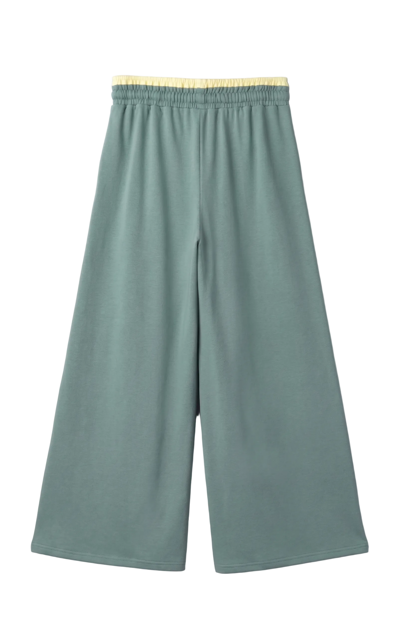 A professional flat lay front view of the orange wide-leg lounge pants, showcasing the oversized teal, pink, and blue floral patches and the yellow contrast waistband.