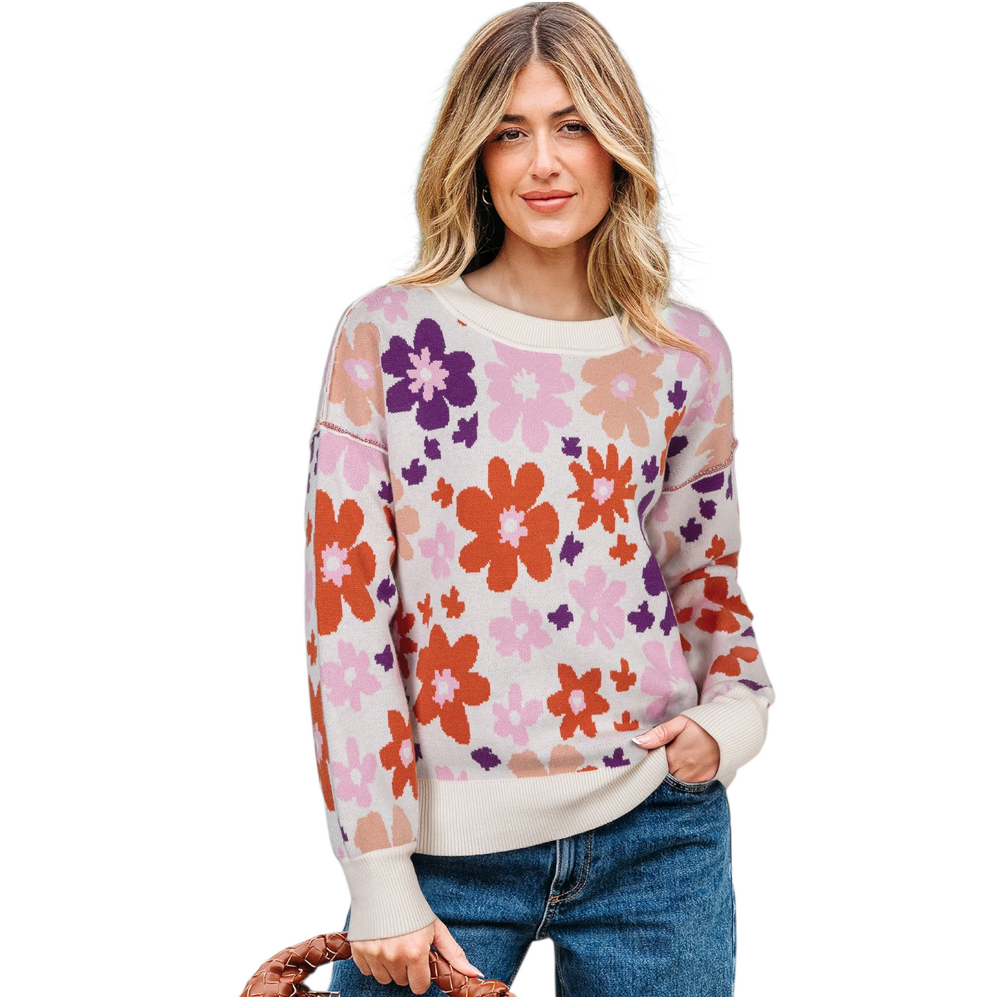 Woman wearing a colorful floral sweater on a white background