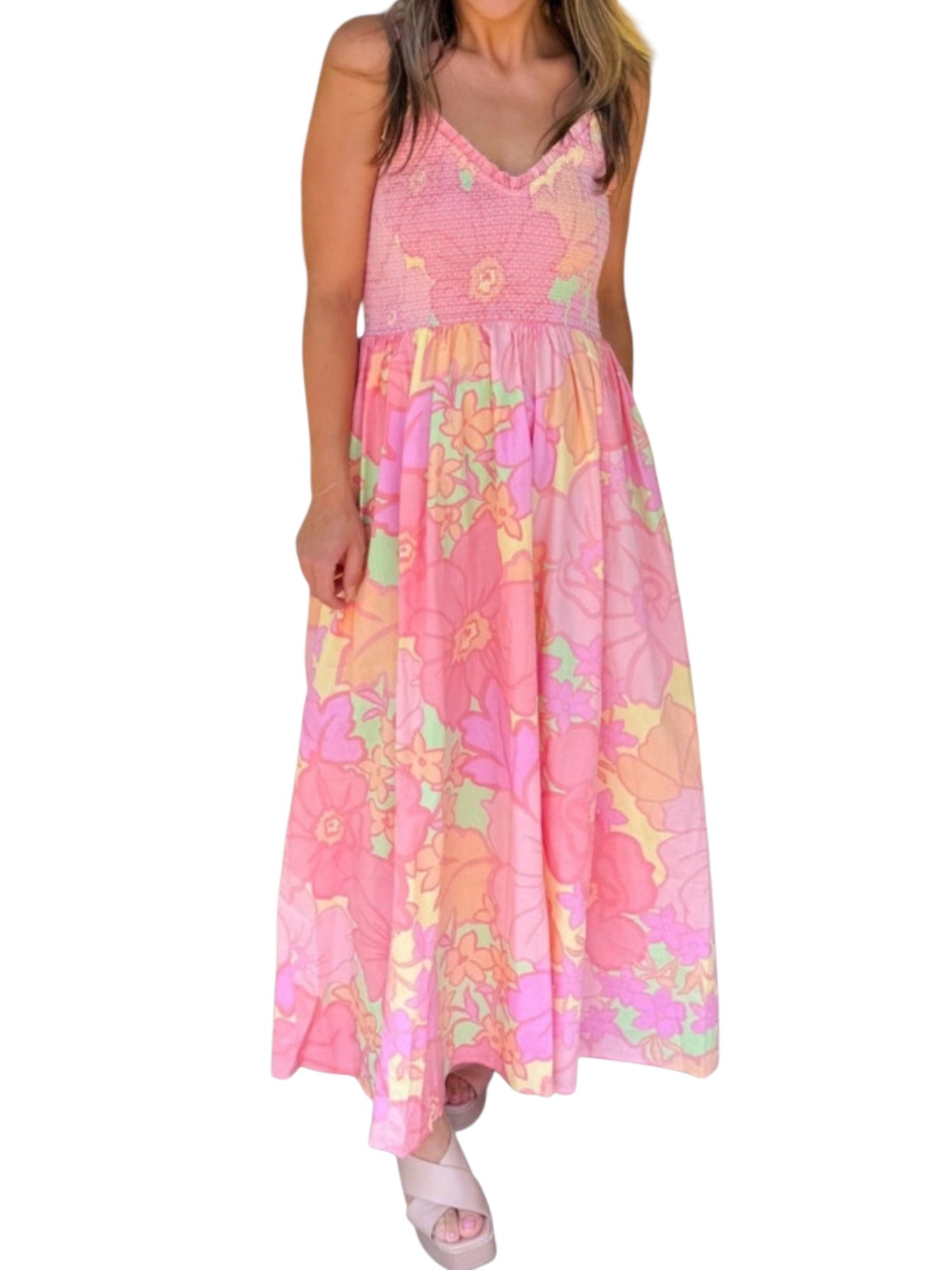 Woman wearing a pink floral dress on a white background