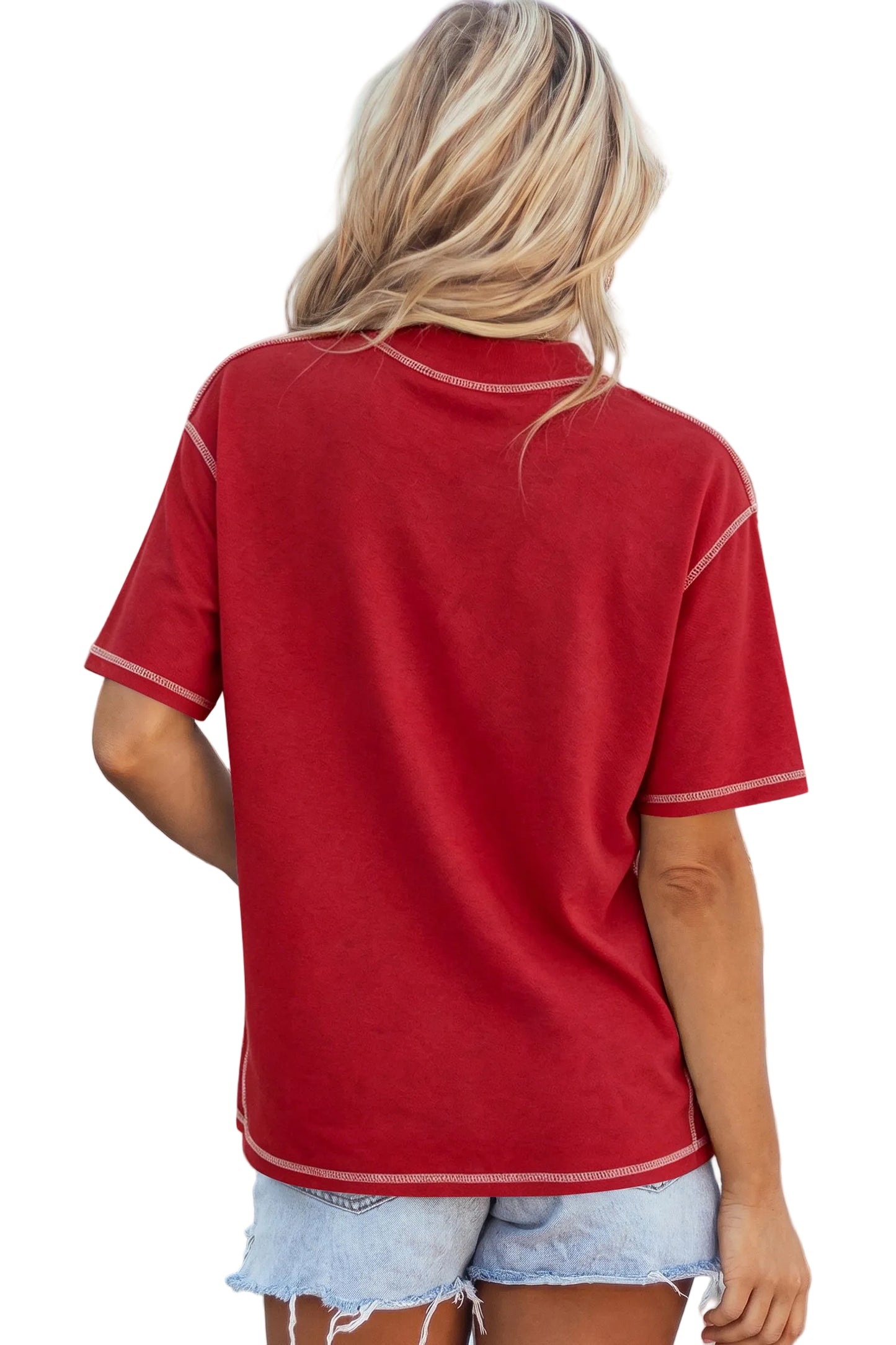 Rear view of a model wearing a crimson red drop-shoulder basic tee with white structural exposed contrast stitching paired with light denim shorts.