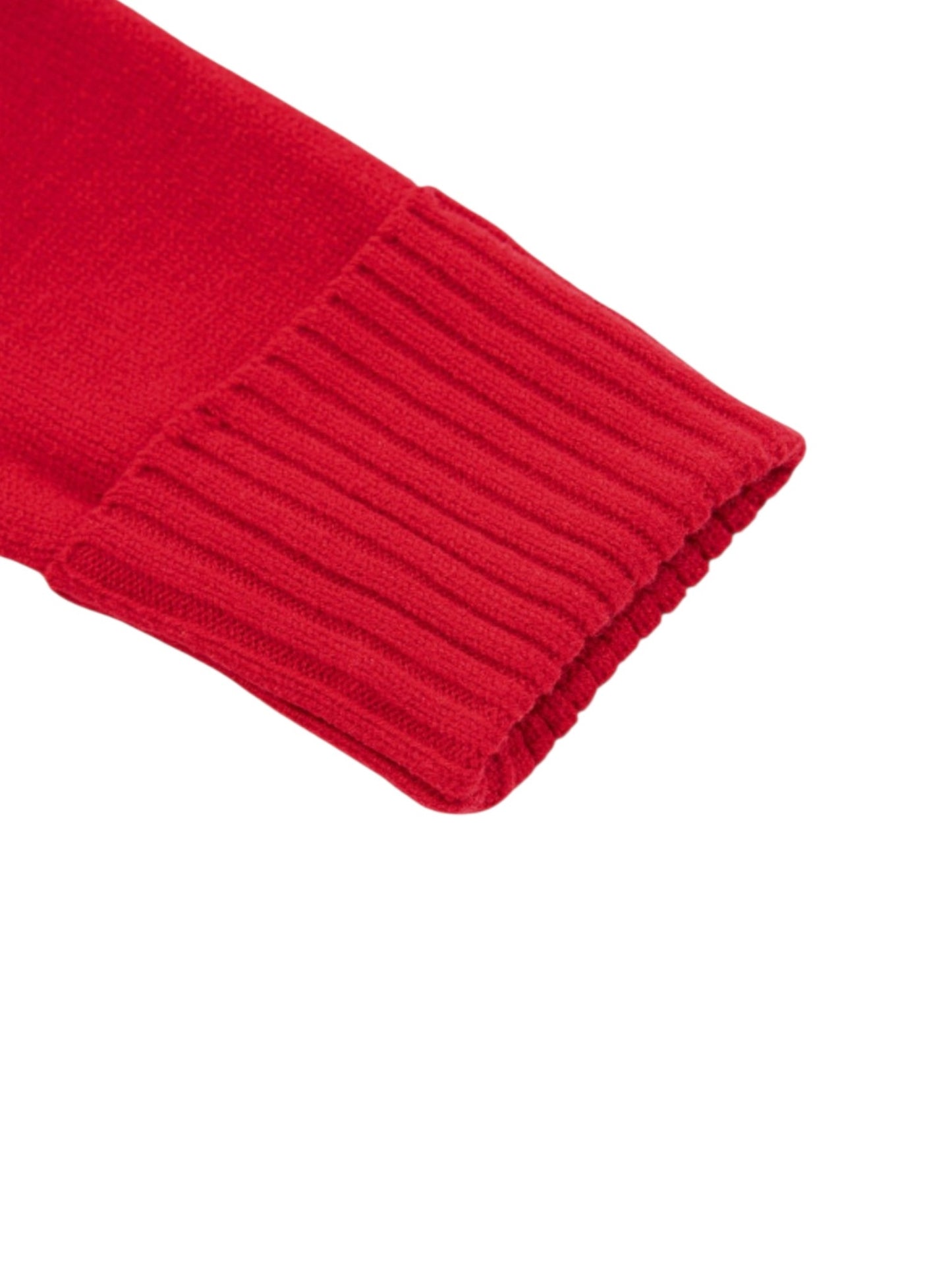 A close-up detail shot of a bright red ribbed knit sleeve cuff on a plain white background.