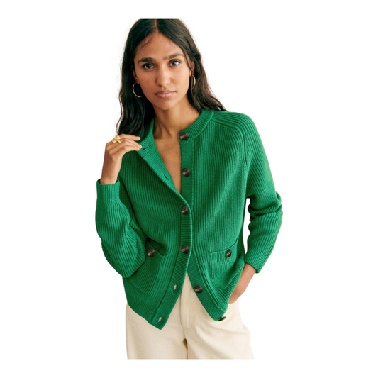 Woman wearing a green cardigan on a white background