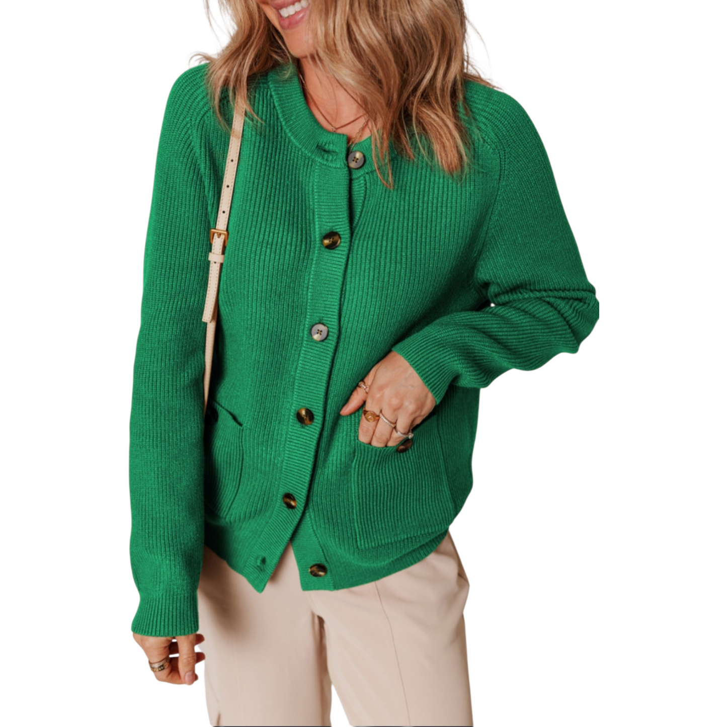 Green cardigan worn by a person on a white background