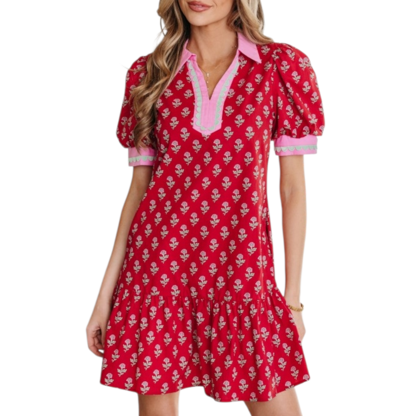 Woman wearing a red floral cotton mini dress with pink ricrac trim, V-neckline, and puff sleeves.