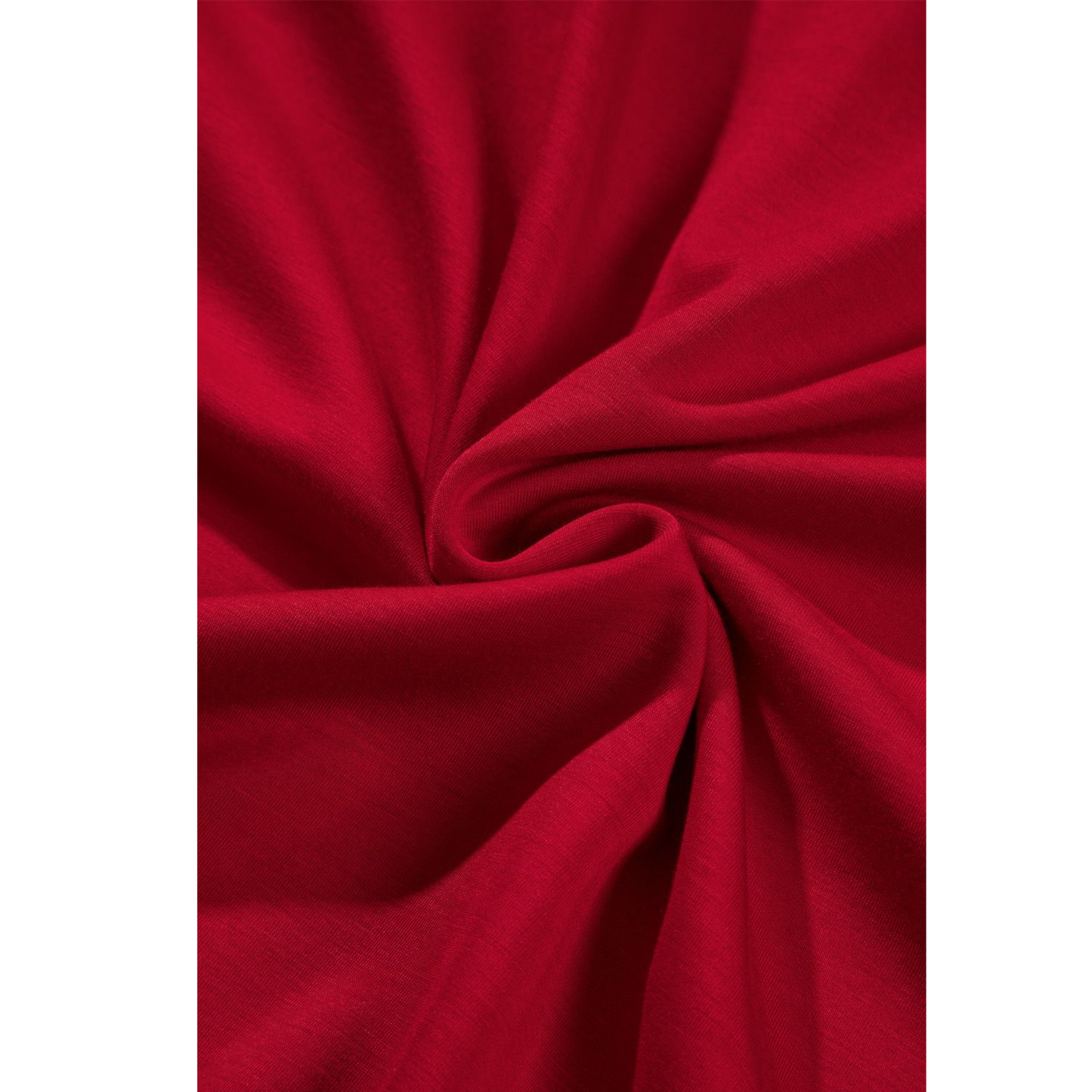 Close-up of red fabric with folds on a white background