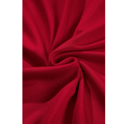 Close-up of red fabric with folds on a white background