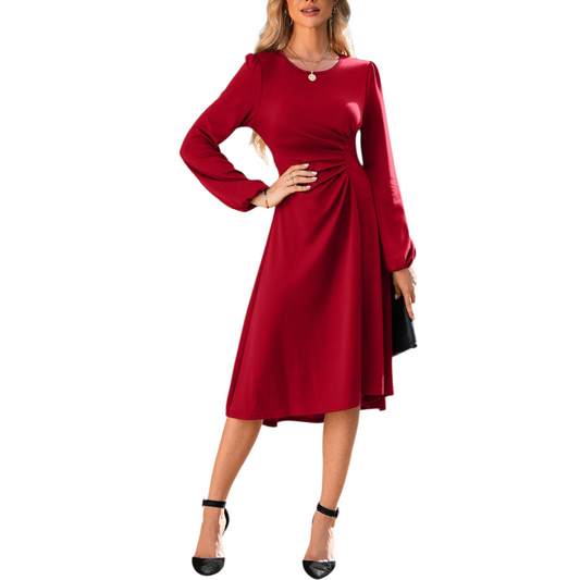 Red dress with long sleeves worn by a model on a white background