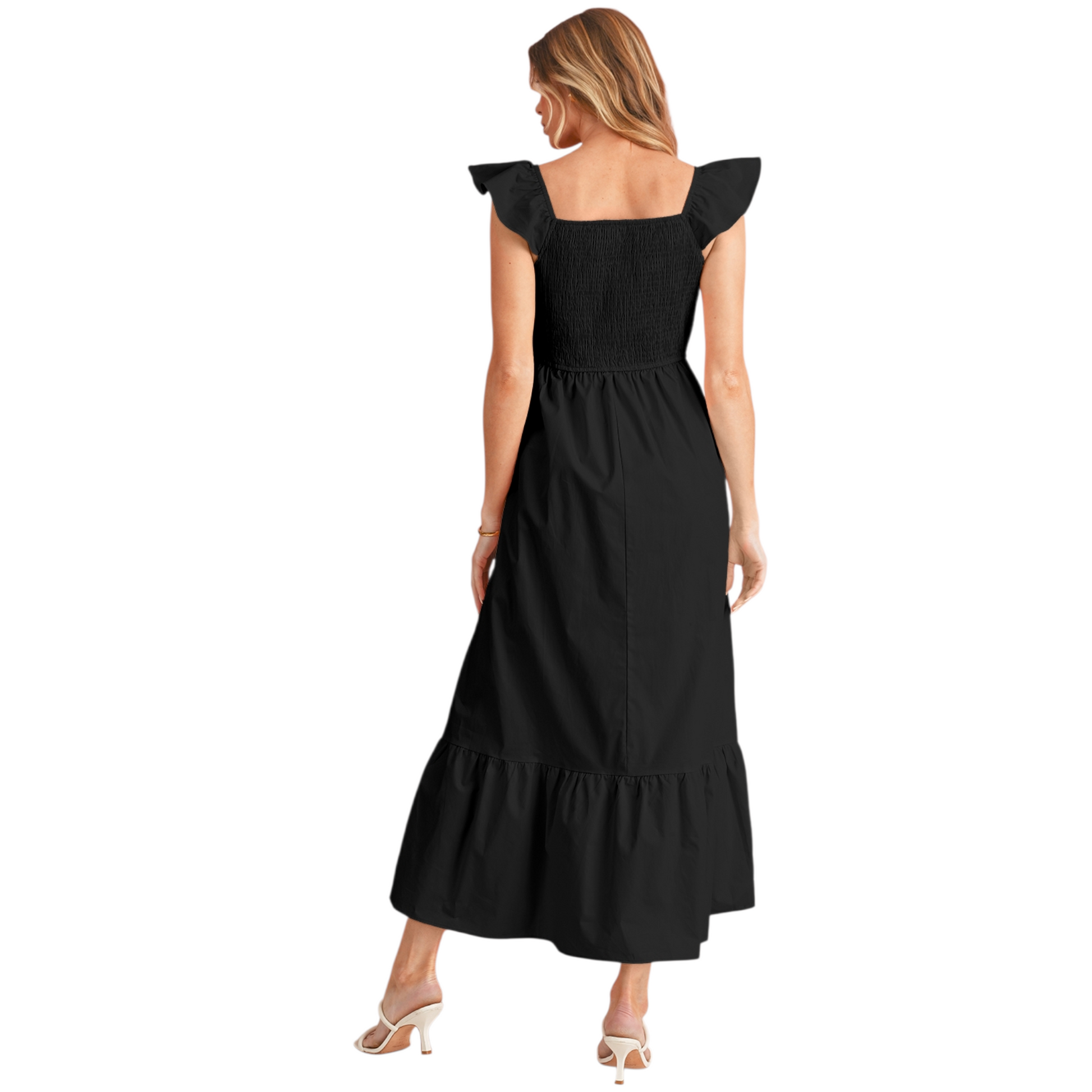 Back view of a woman wearing a black 100% cotton maxi dress with a smocked elastic bodice, feminine ruffle shoulder straps, and a tiered flowy skirt.