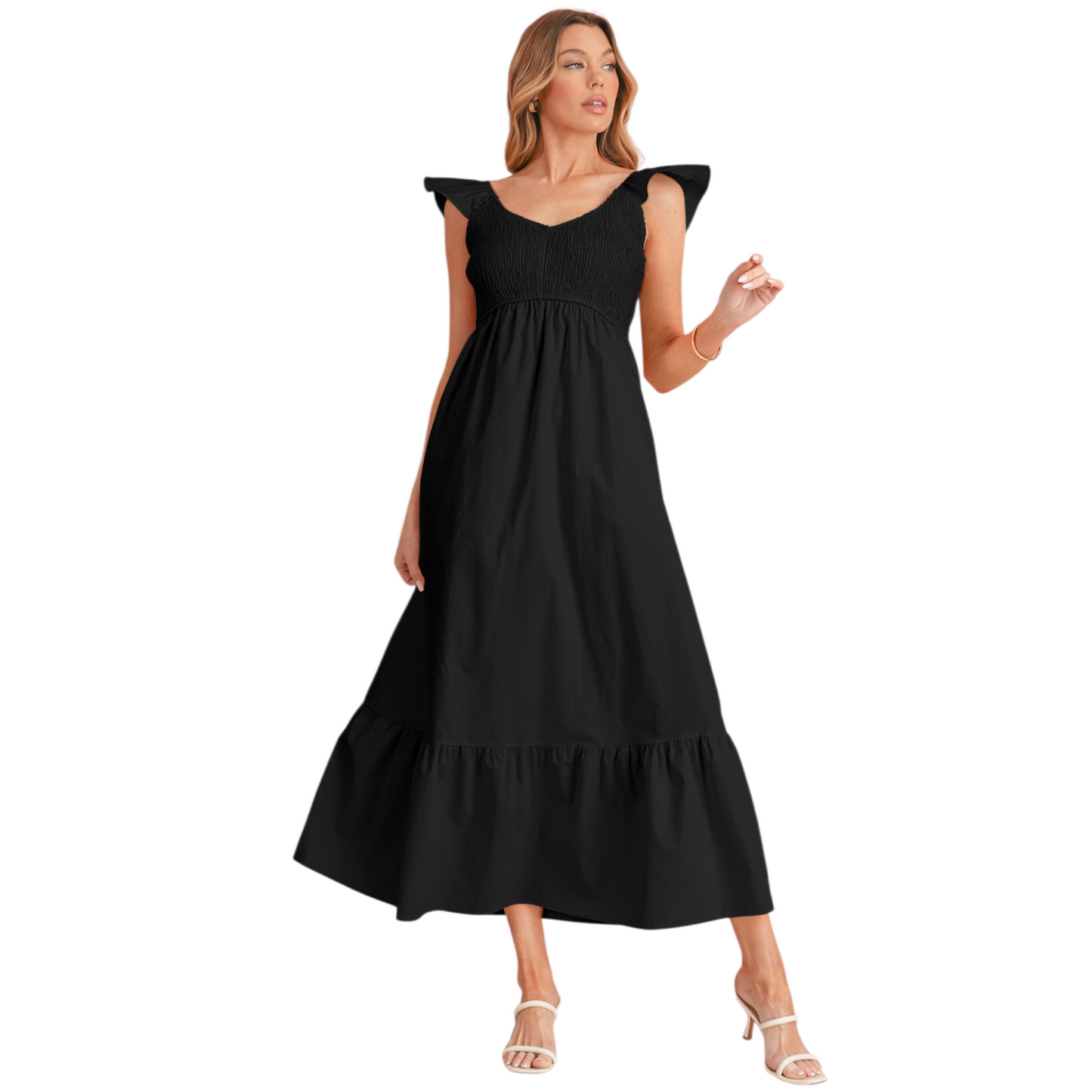 A woman wearing a black 100% cotton maxi dress with a smocked elastic bodice, feminine ruffle shoulder straps, and a tiered flowy skirt.