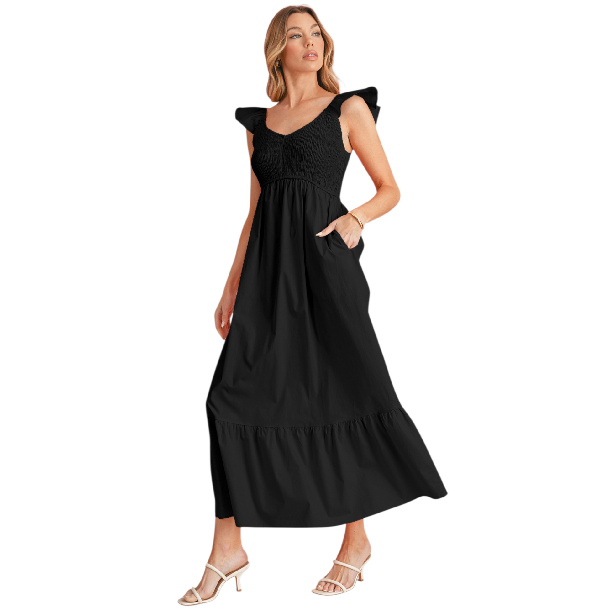 Model showcasing a black tiered cotton maxi dress, highlighting functional side pockets and the comfortable, relaxed fit.