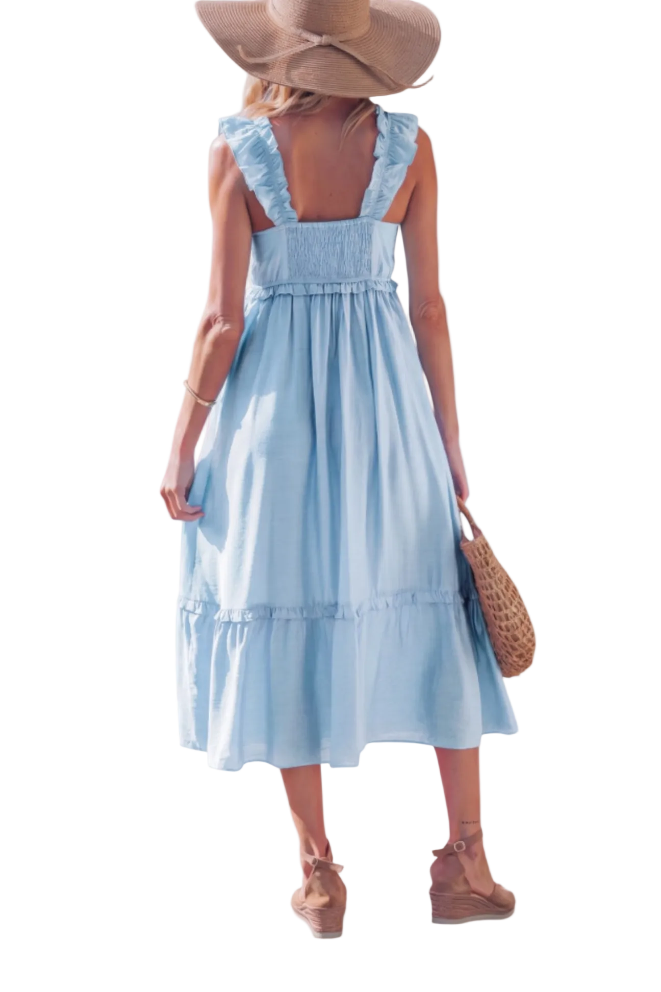 Woman wearing a light blue dress with ruffled straps and hem, holding a straw bag on a white background.