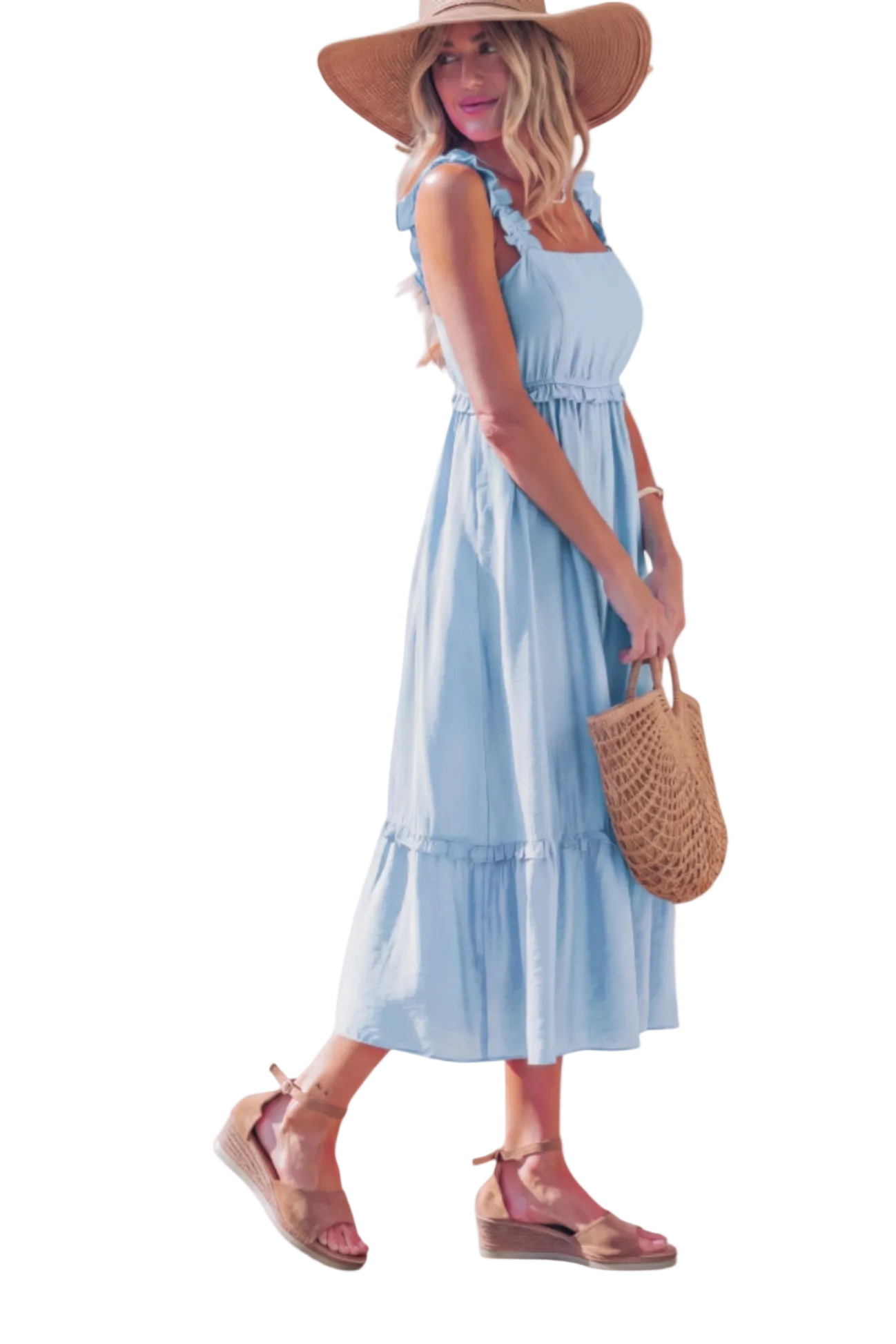 Side profile of the blue tiered midi dress highlighting the graceful movement of the flared hem and the soft, fluid drape of the viscose fabric.