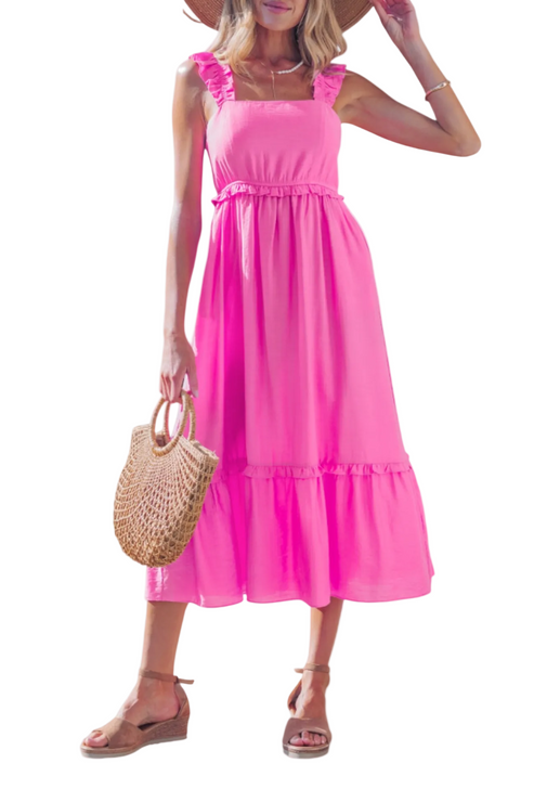 Vibrant pink tiered midi dress with ruffled shoulder straps and a high-waist silhouette, perfect for summer weddings or garden parties.