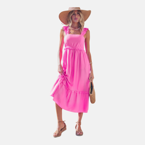 Vibrant pink tiered midi dress with ruffled shoulder straps and a high-waist silhouette, perfect for summer weddings or garden parties.